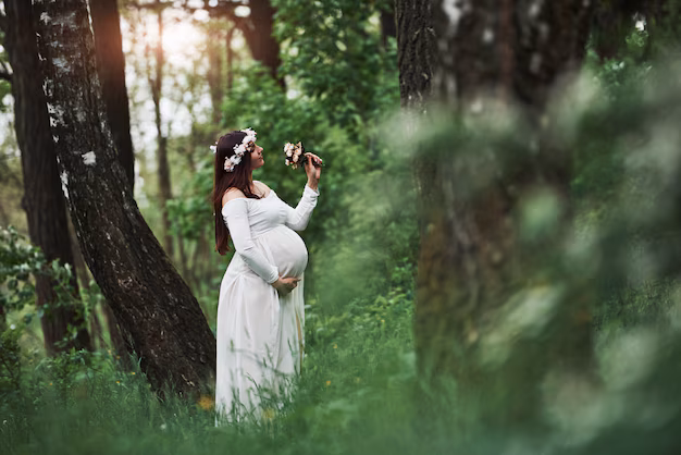 sunlight-flowers-beautiful-pregnant-woman-dress-have-walk-outdoors-positive-brunette_146671-16629